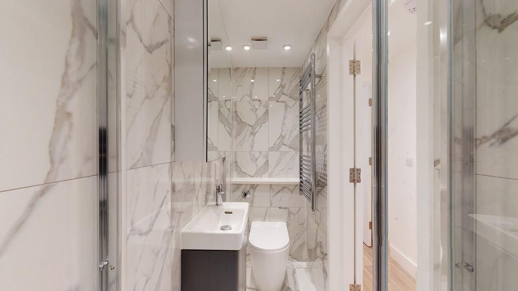 Bright and modern bathroom featuring elegant ma...