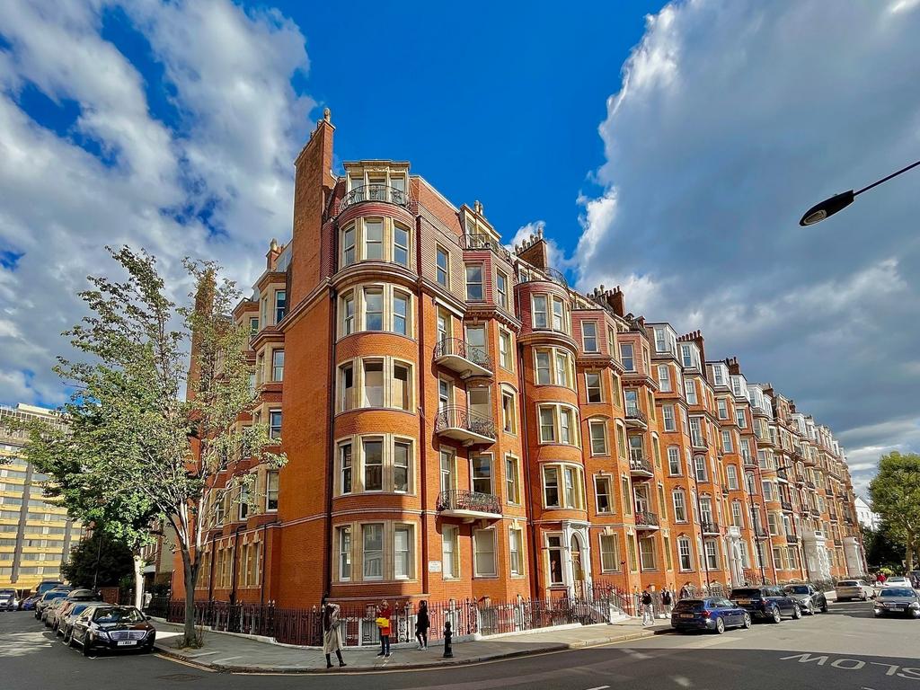 A striking corner view of a classic red brick t...