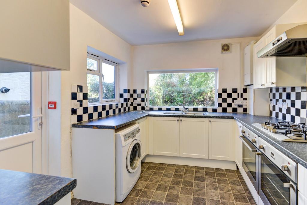 Bright and clean kitchen featuring ample natura...
