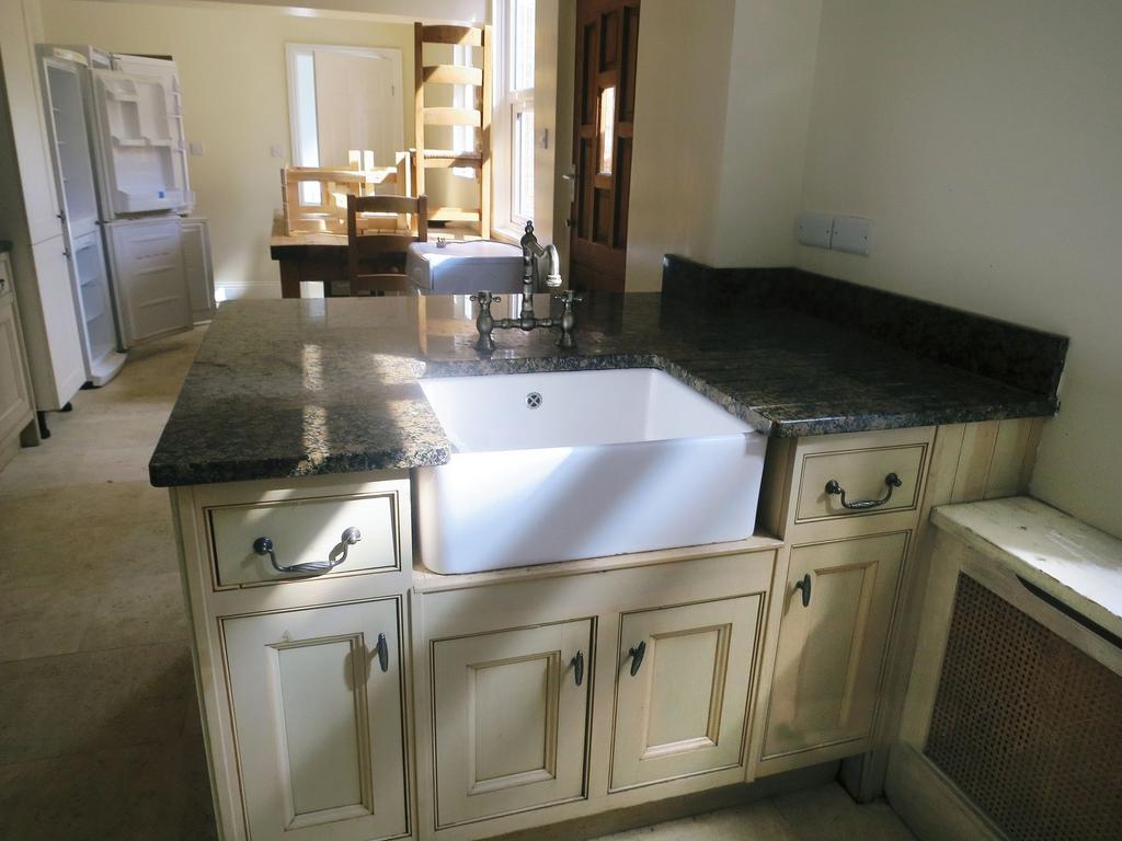 A well-maintained kitchen featuring a large gra...