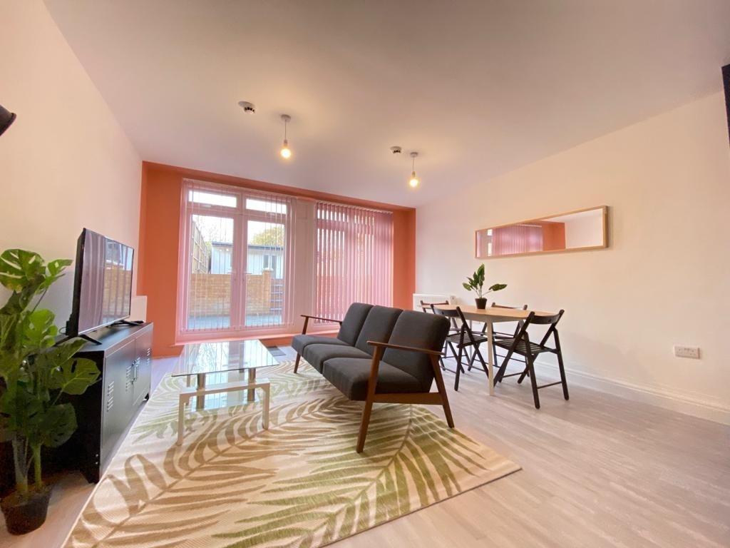 Bright and welcoming living room featuring a la...