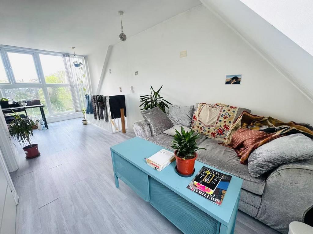 Bright and airy living room with large windows ...