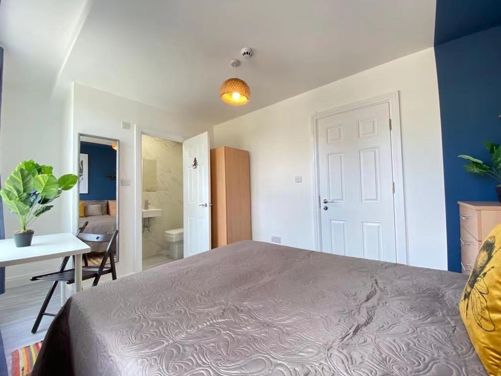 Bright and airy bedroom featuring a comfortable...