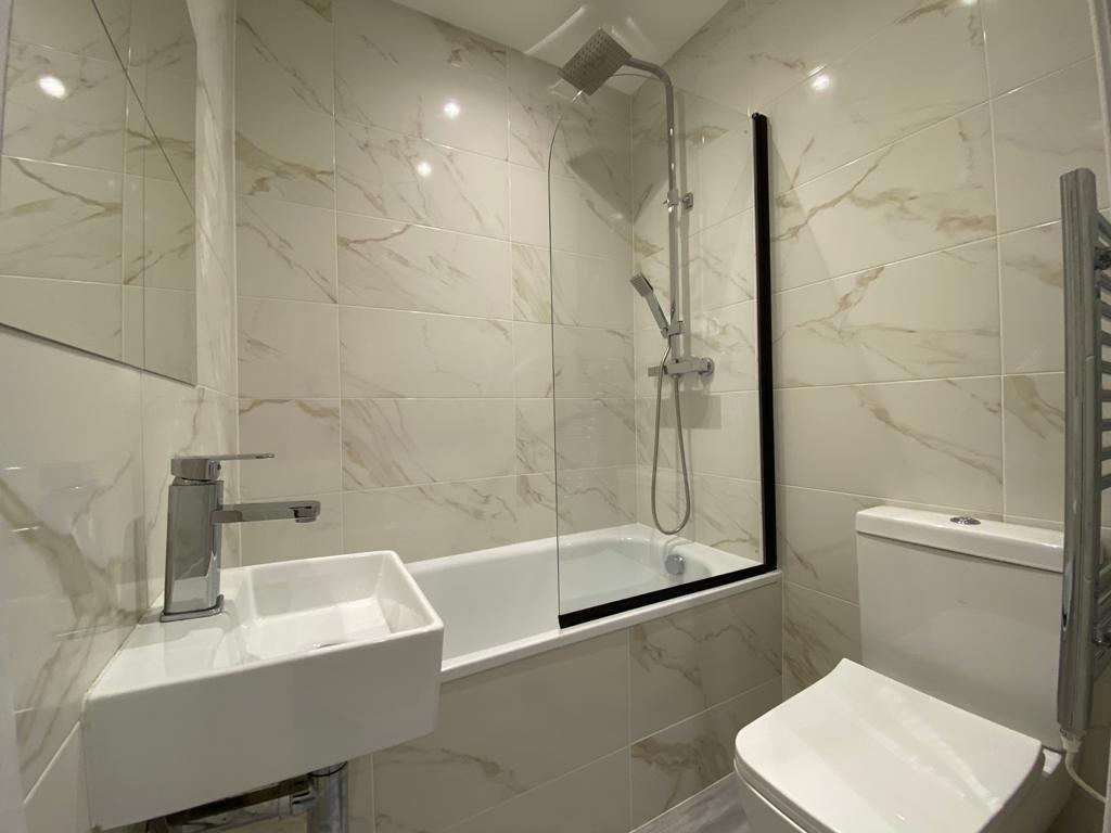 A modern, well-maintained bathroom featuring a ...