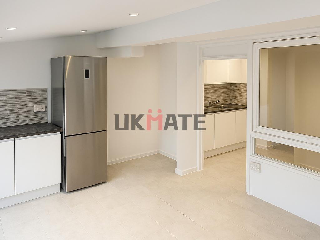 Modern and sleek kitchen with clean white cabin...