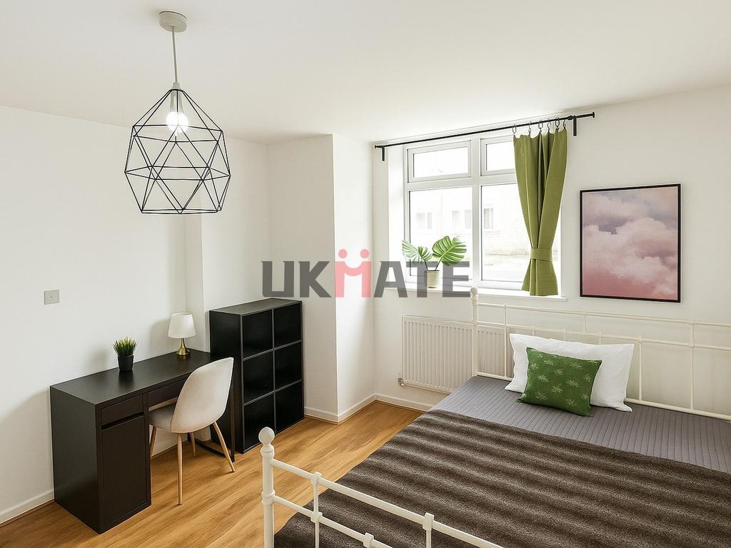 Bright and inviting bedroom featuring a cozy be...