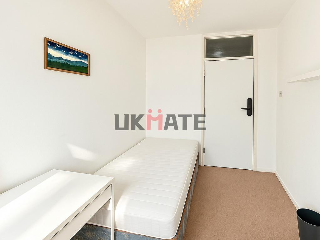 A bright and clean double bedroom with a simple...