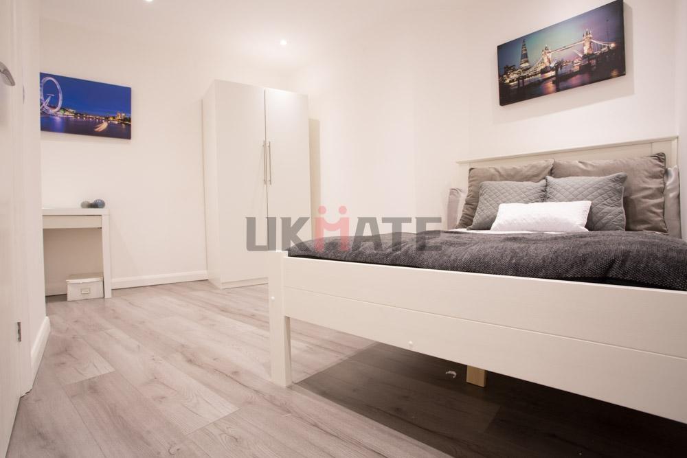 A modern, well-maintained bedroom with a comfor...