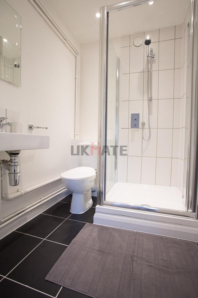 A modern and clean bathroom featuring a shower ...