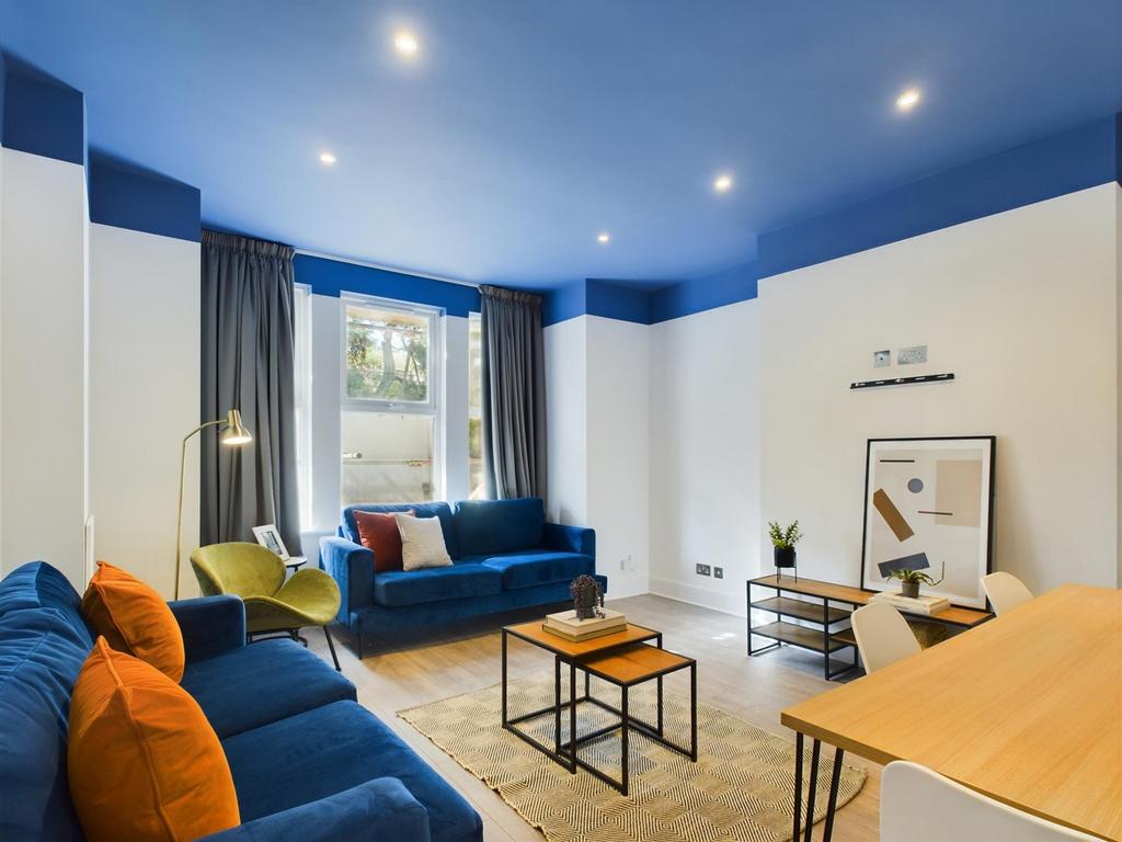 A spacious and stylish modern living room, perf...