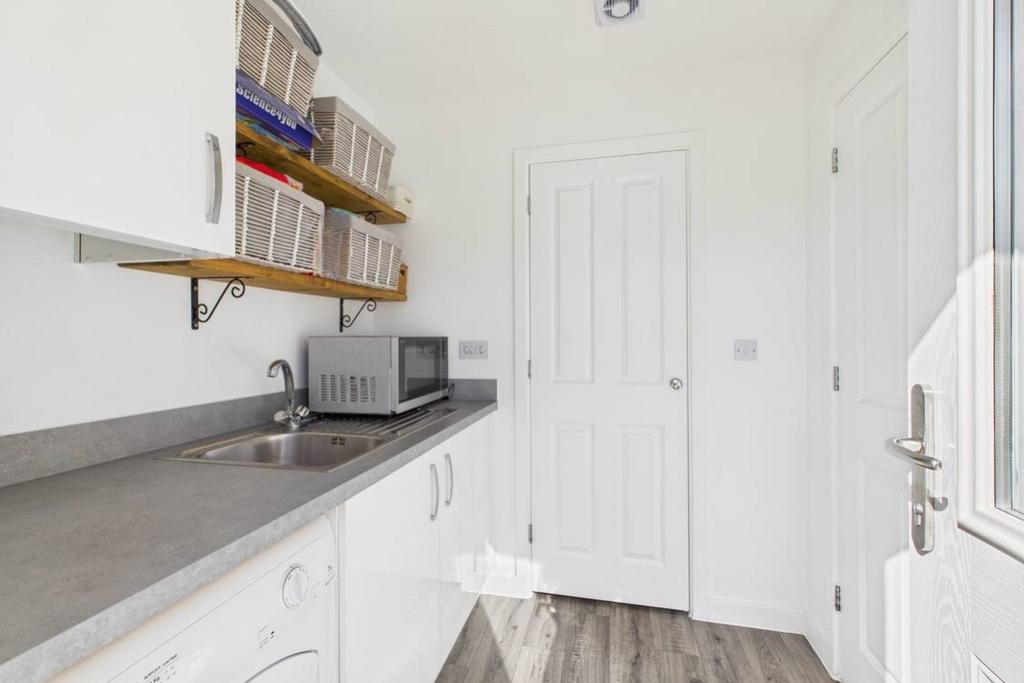 A view from the back door showing a cupboard housi