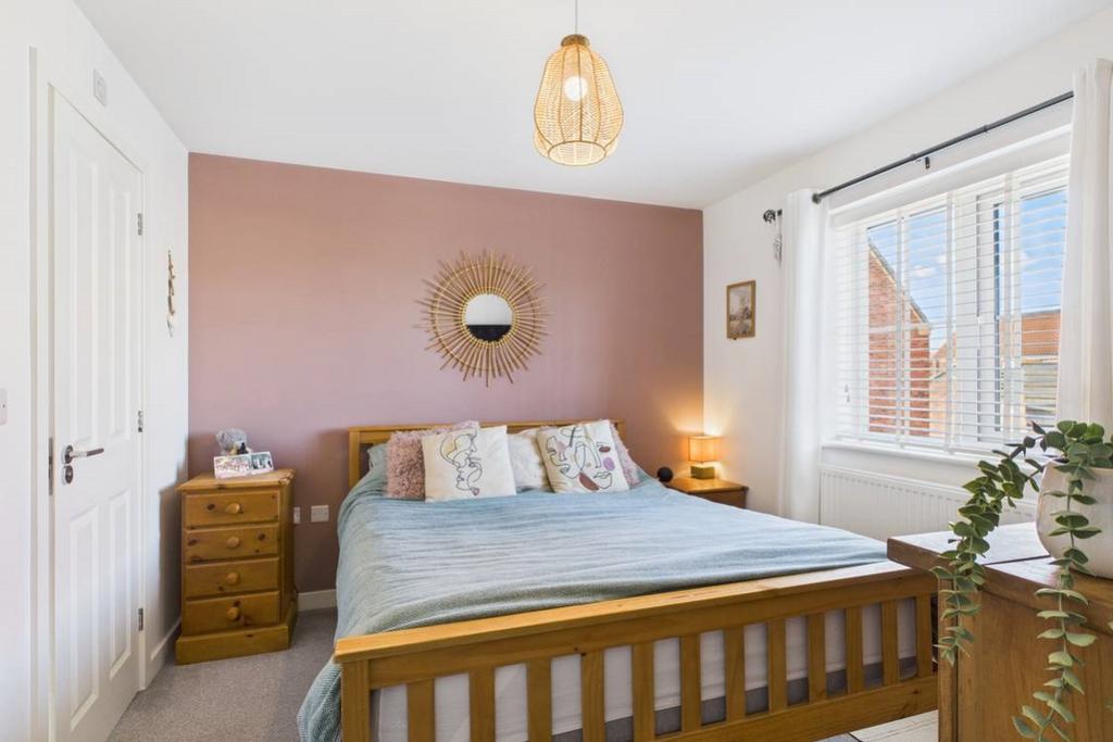 The main bedroom with its large window is the perf