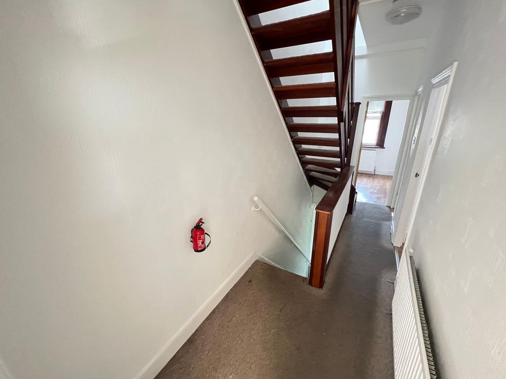 A clean and well-maintained hallway with neutra...