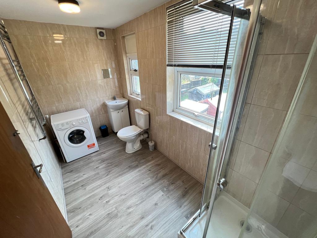 Bright and well-maintained bathroom featuring a...