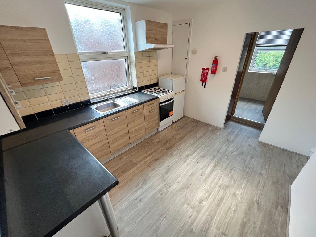 Bright and clean kitchen featuring modern wood-...