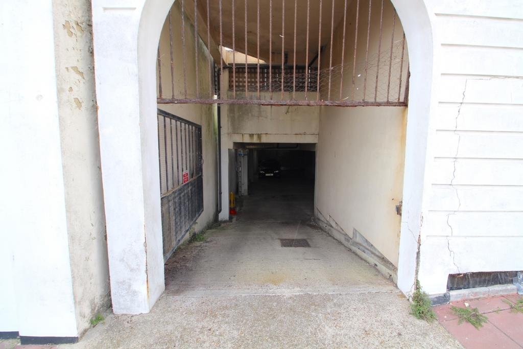 Secure gated entry to garage parking