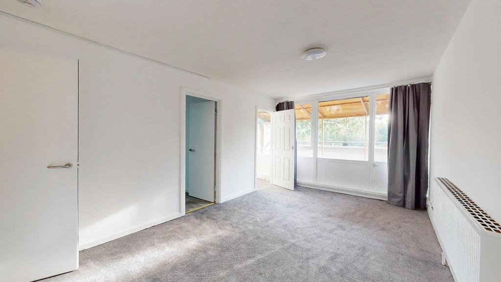 Bright and spacious living room with large wind...