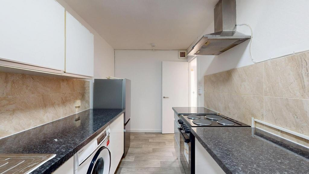 Well-maintained kitchen featuring black granite...