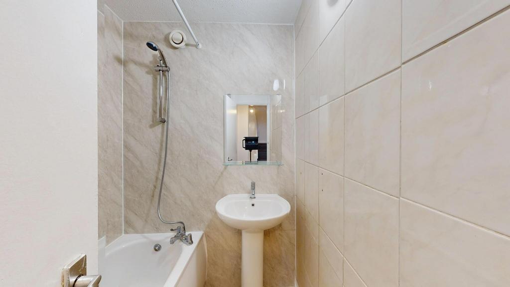 A clean and functional bathroom featuring a bat...