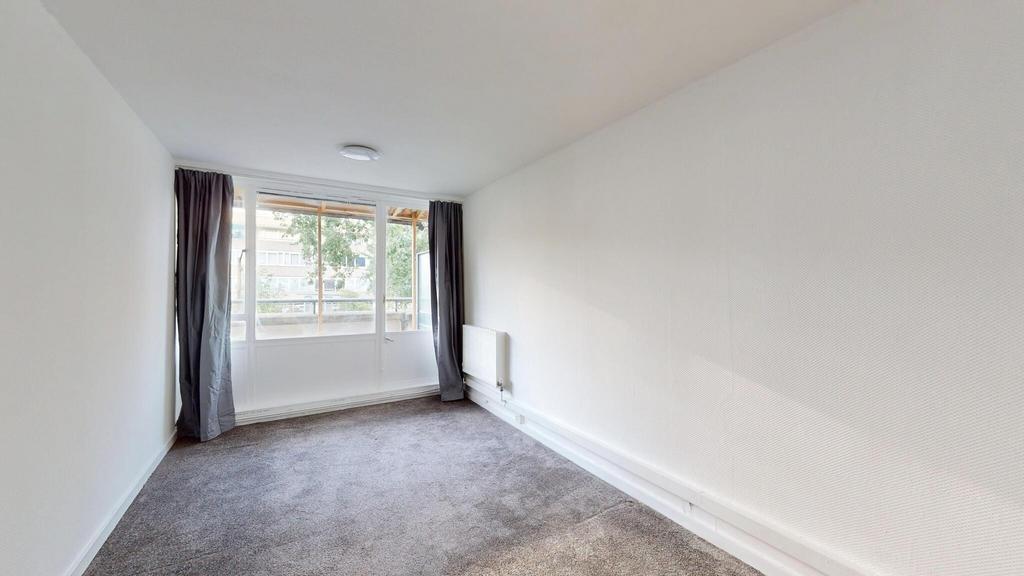Bright and welcoming living room with large win...