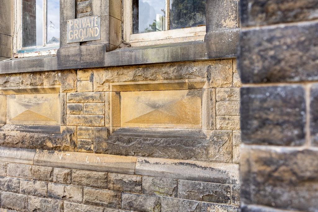 Stone Lozenges Beneath Windows