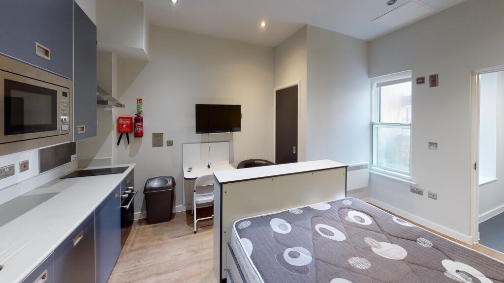 A bright and modern living room with ample natu...