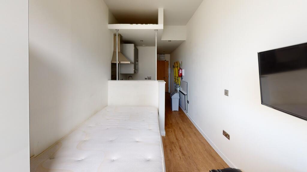 A small, clean bathroom with a WC and minimal d...