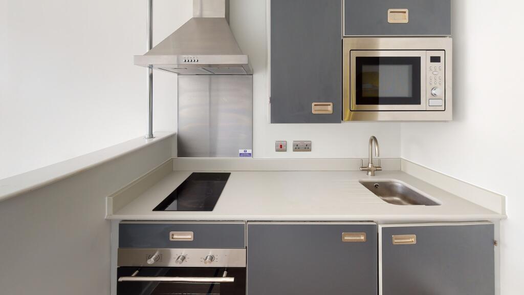 A modern, well-maintained kitchen with sleek ca...