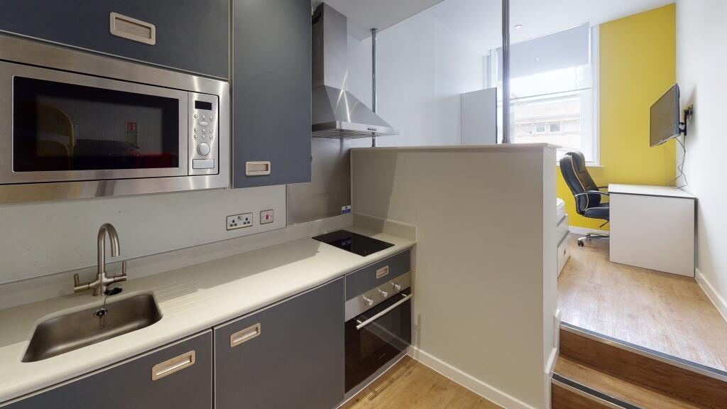 A modern, well-maintained kitchen with ample na...