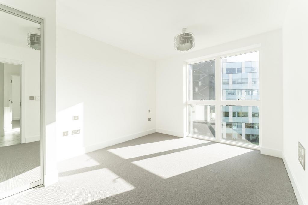 Bright and airy double bedroom featuring large ...