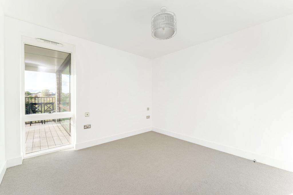 Bright and clean double bedroom featuring prist...