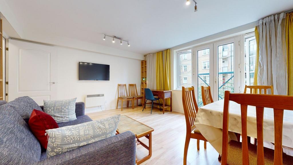 Bright and spacious living area featuring large...