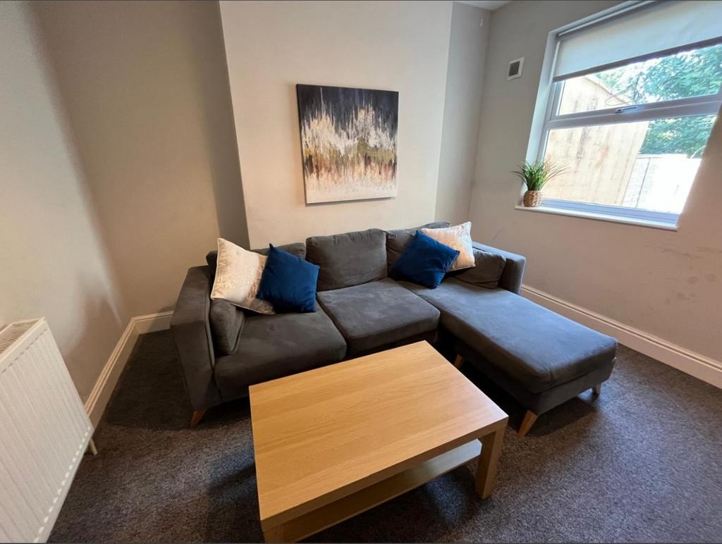 Bright lounge with comfortable sofa and coffee ...