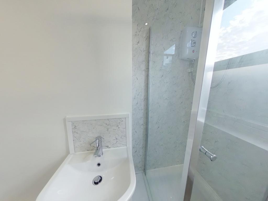 A bright and modern bathroom featuring a sleek ...