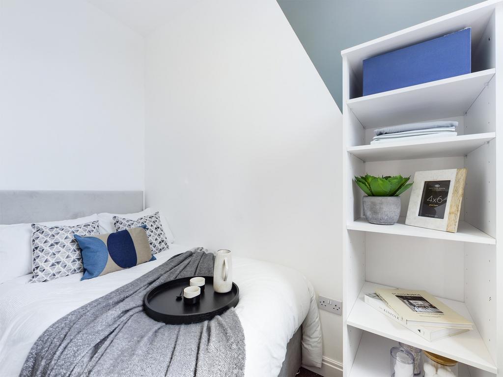 A stylish and inviting double bedroom with mode...