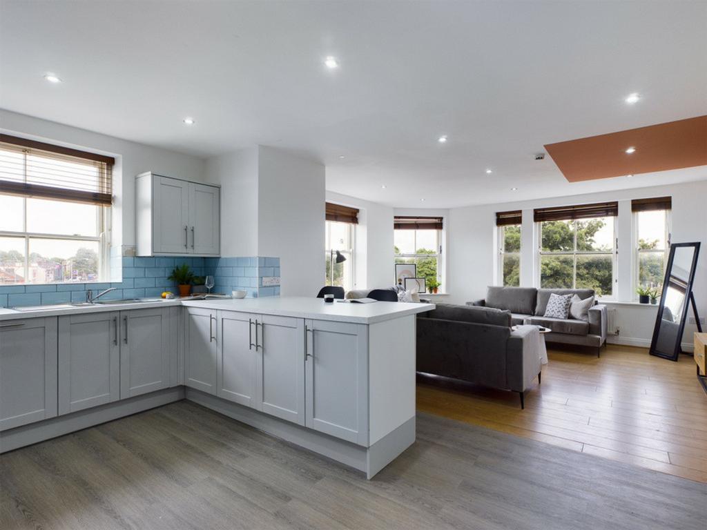 A spacious and modern kitchen with plenty of na...