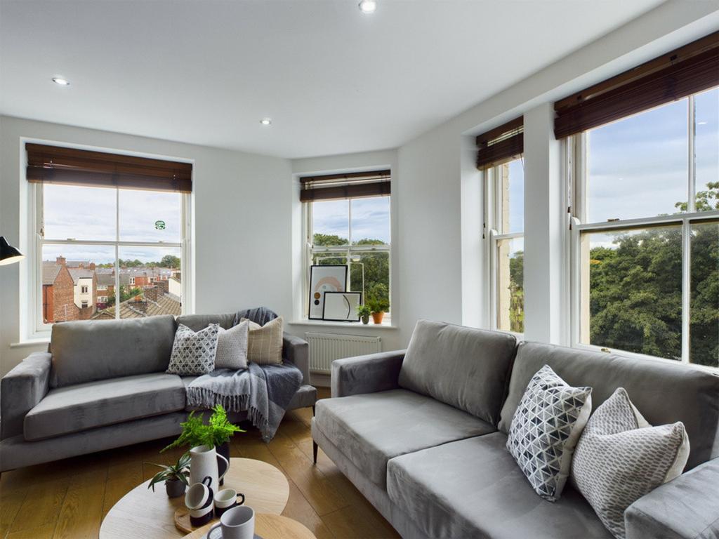 A spacious and stylish modern living room with ...