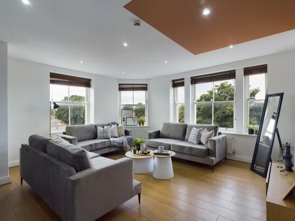 A spacious and stylish modern living room fille...