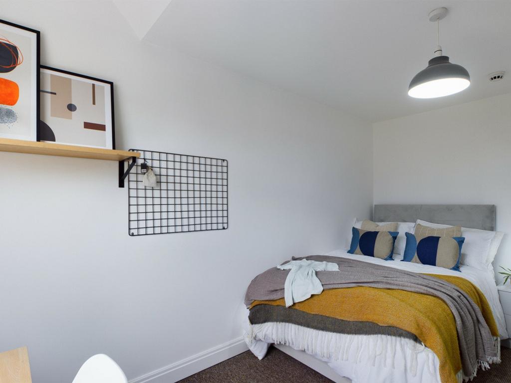 A stylish and inviting double bedroom featuring...