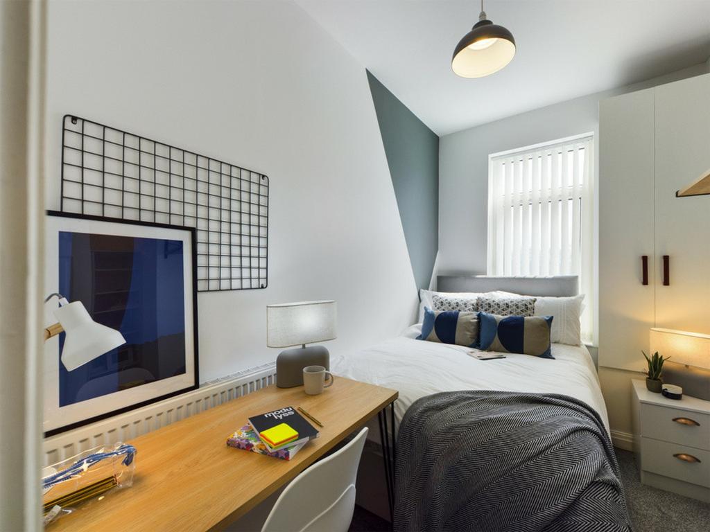 A stylish and well-lit double bedroom featuring...