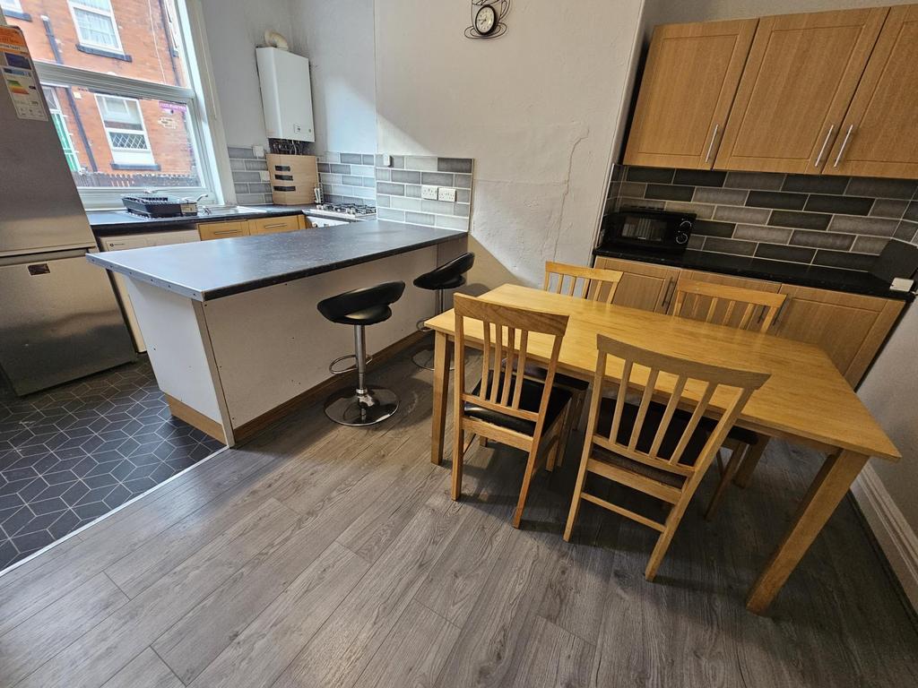 Bright and modern kitchen area featuring a coun...
