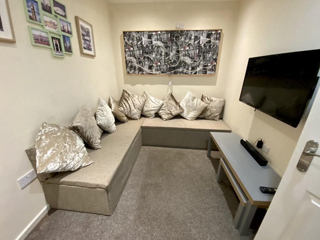 A cozy living room with comfortable seating, pe...