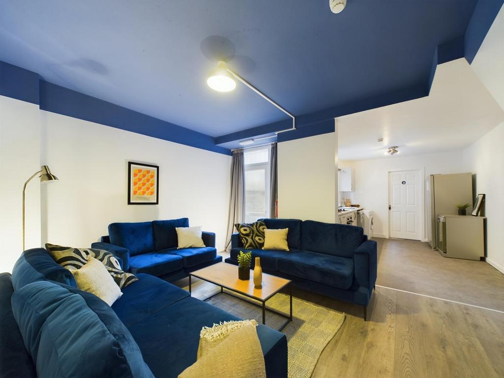 A spacious and stylish modern living room, perf...