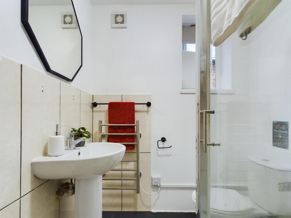 A clean and modern bathroom featuring a stylish...