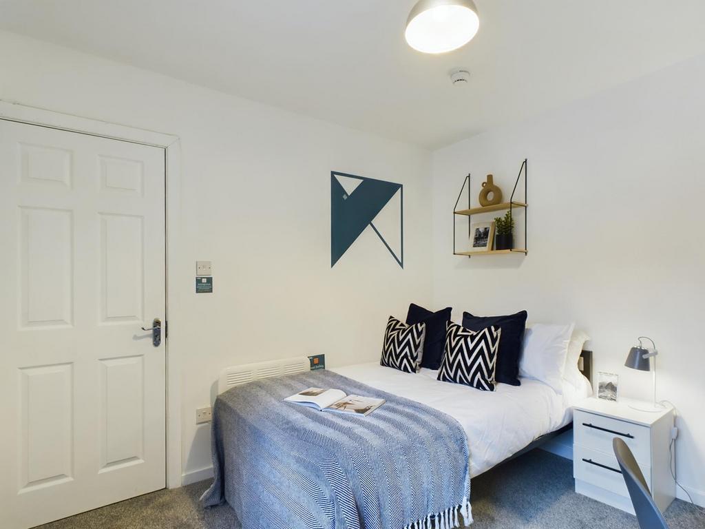 A stylish and inviting double bedroom with mode...