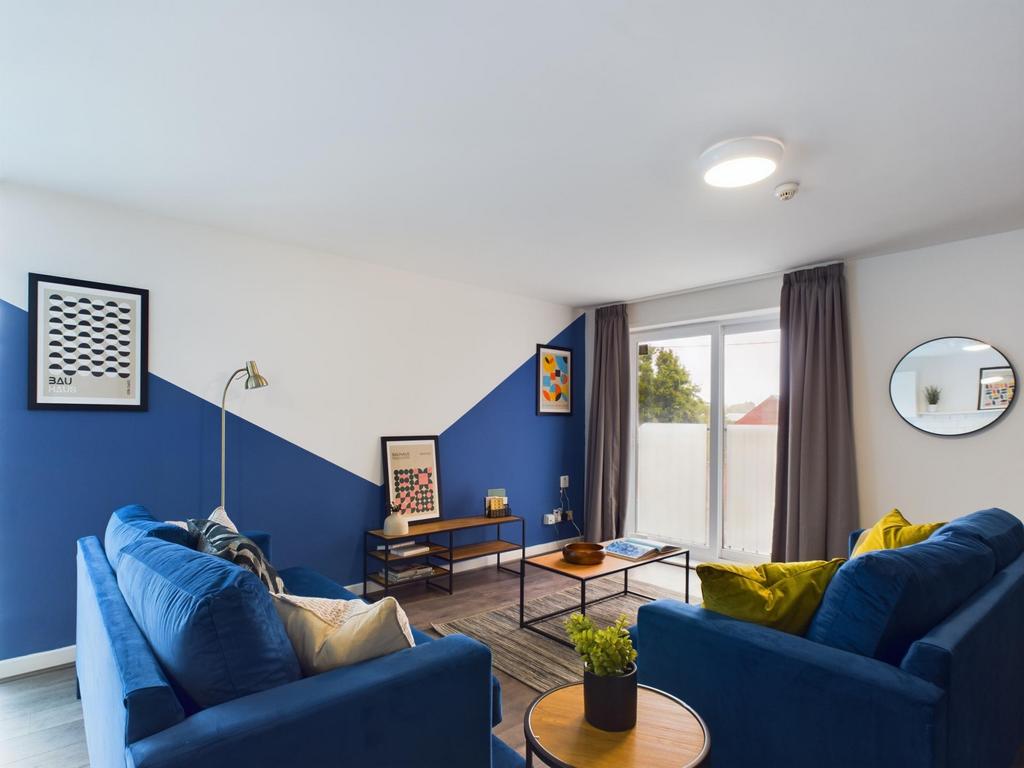 A modern and inviting living room featuring sty...