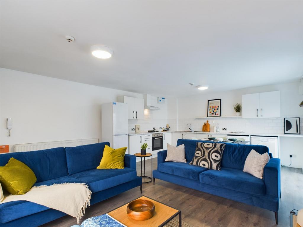 A bright and inviting living room featuring mod...
