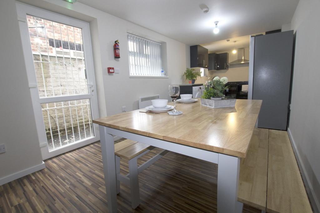 A bright and tidy kitchen area featuring a larg...