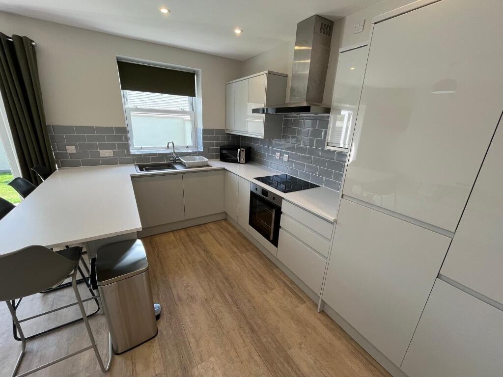 Modern and clean kitchen with ample counter spa...