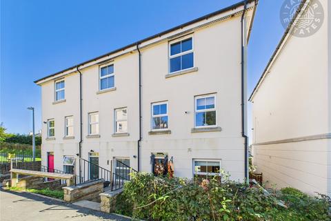 “An attractive and well-designed townhouse, perfect for families, with four bedrooms and two allocated parking spaces.”